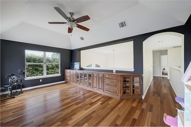 3612 Short Horn Ln, Round Rock, TX 78665 - living area with wood finished floors, arched walkways, a ceiling fan, and high vaulted ceiling