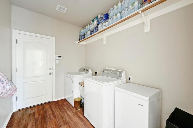 3612 Short Horn Ln, Round Rock, TX 78665 - laundry room featuring independent washer and dryer and wood finished floors