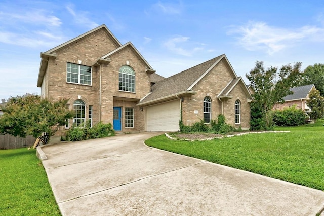 3612 Short Horn Ln, Round Rock, TX 78665 - traditional home with brick siding, a front yard, concrete driveway, and a garage