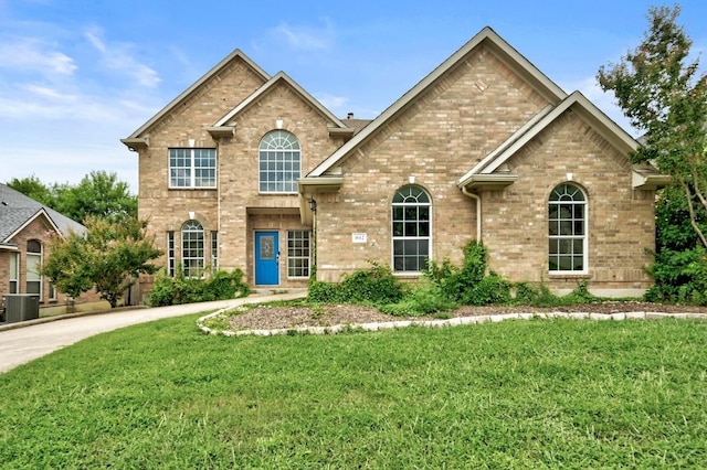 3612 Short Horn Ln, Round Rock, TX 78665 - traditional-style house with brick siding and a front lawn