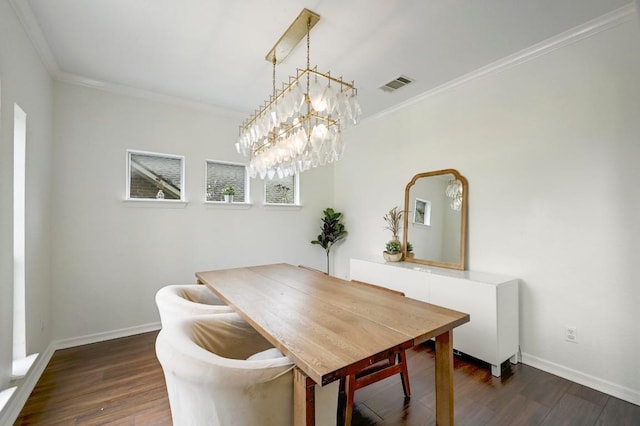 3612 Short Horn Ln, Round Rock, TX 78665 - dining area featuring ornamental molding, dark wood-style floors, and a chandelier