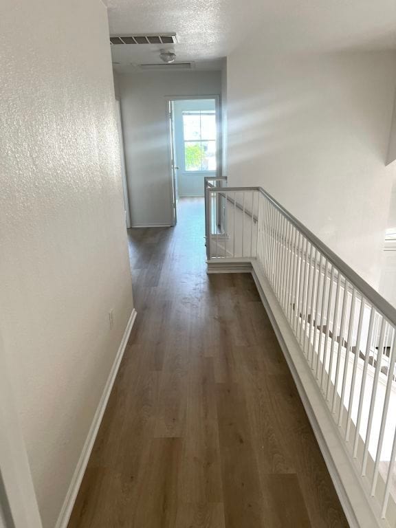 15316 Lady Elizabeth Ln, Pflugerville, TX 78660 - hall featuring an upstairs landing and dark wood-style floors