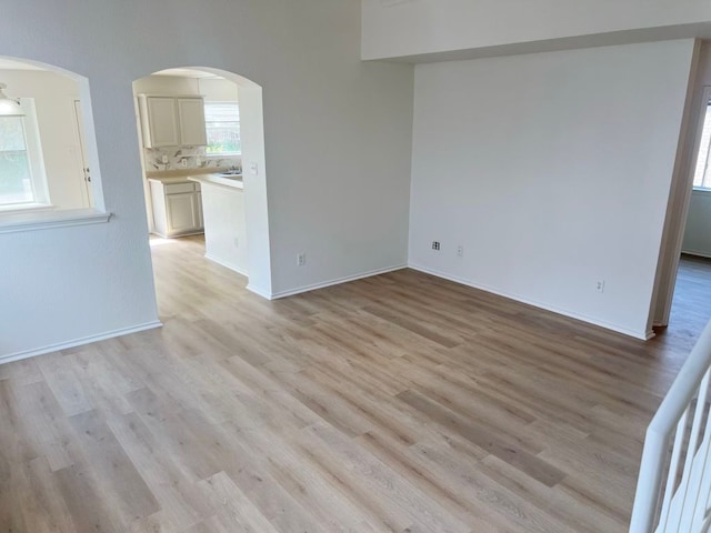 15316 Lady Elizabeth Ln, Pflugerville, TX 78660 - unfurnished room with light wood-style floors and arched walkways