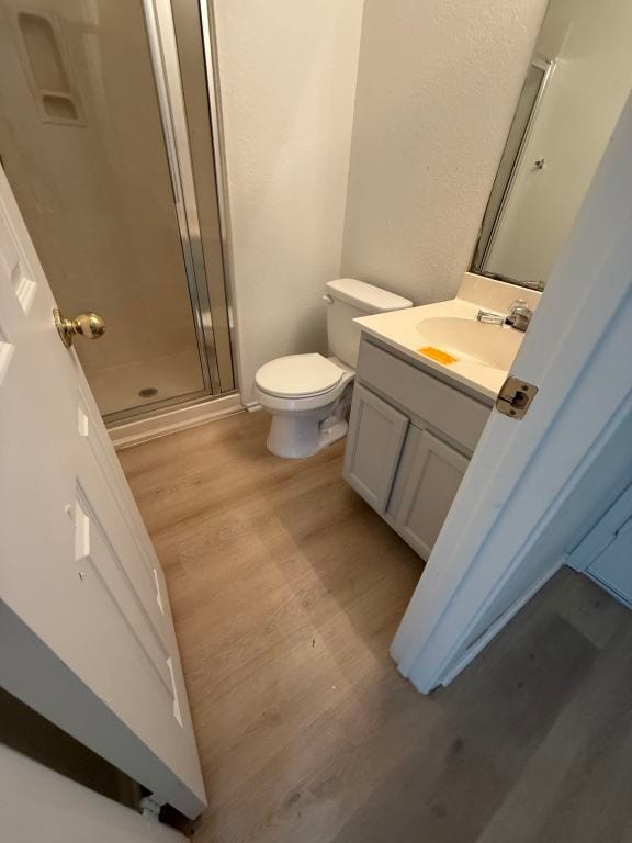 15316 Lady Elizabeth Ln, Pflugerville, TX 78660 - bathroom with wood finished floors, vanity, and a stall shower