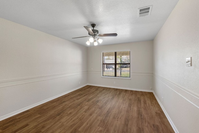 3419 Bluebonnet Trl, Georgetown, TX 78628 - unfurnished room featuring wood finished floors, a ceiling fan, and a textured ceiling