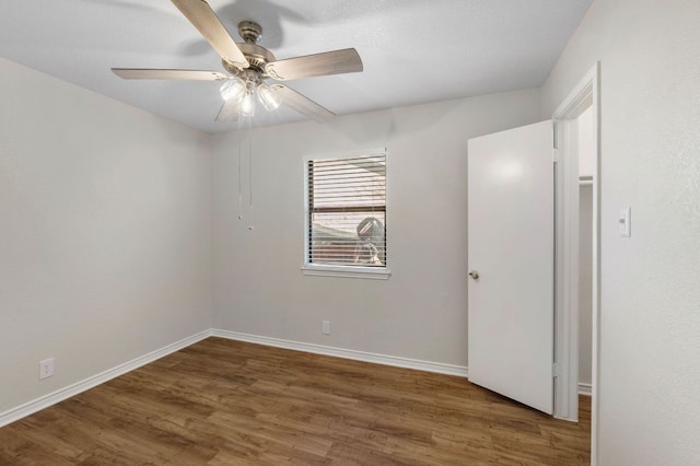 3419 Bluebonnet Trl, Georgetown, TX 78628 - empty room featuring wood finished floors and a ceiling fan
