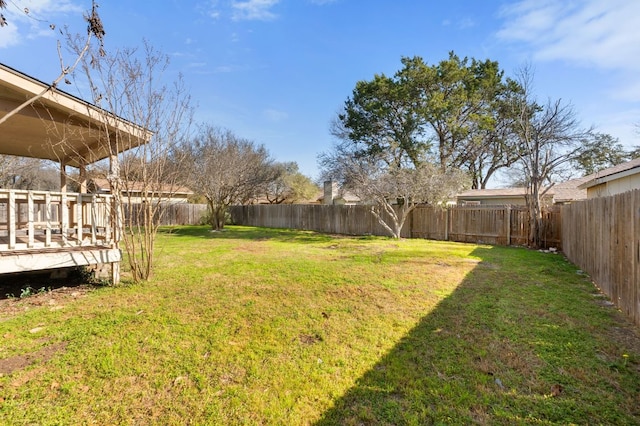 3419 Bluebonnet Trl, Georgetown, TX 78628 - fenced backyard featuring a deck