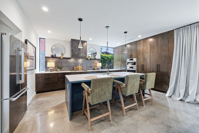 2309 E 5th St, Austin, TX 78702 - kitchen with finished concrete flooring, modern cabinets, high end fridge, tasteful backsplash, and recessed lighting