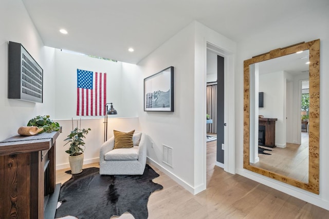 2309 E 5th St, Austin, TX 78702 - sitting room with wood finished floors and recessed lighting
