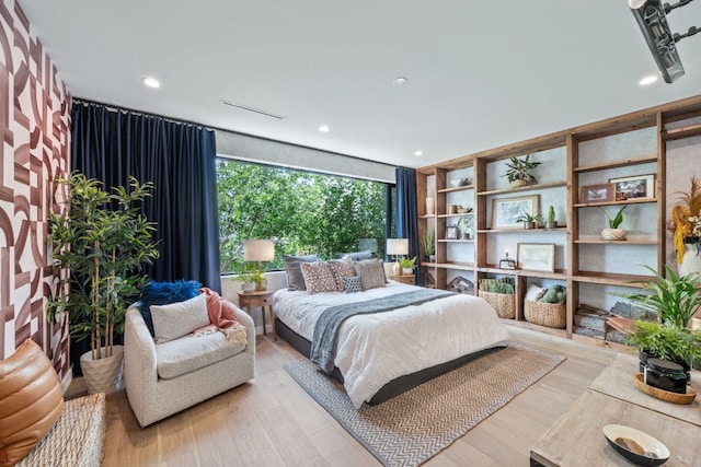 2309 E 5th St, Austin, TX 78702 - bedroom featuring wood finished floors and recessed lighting
