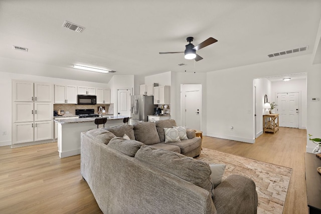 413 Luna Vista Dr, Hutto, TX 78634 - living room with a ceiling fan and light wood-style flooring