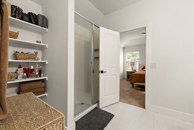 413 Luna Vista Dr, Hutto, TX 78634 - ensuite bathroom featuring a shower stall and baseboards