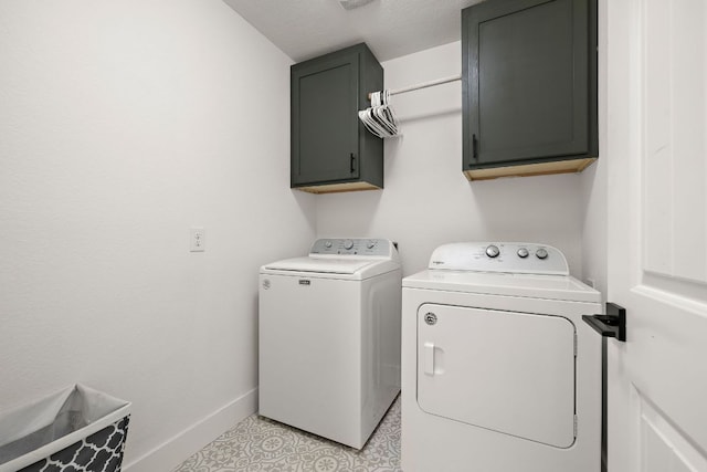 413 Luna Vista Dr, Hutto, TX 78634 - laundry area featuring washer and clothes dryer and cabinet space