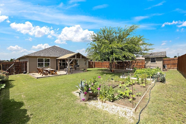 413 Luna Vista Dr, Hutto, TX 78634 - rear view of property featuring a garden, a gazebo, a fenced backyard, and a patio