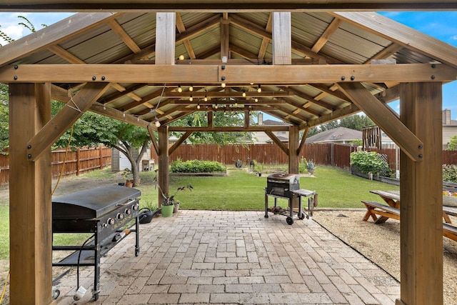 413 Luna Vista Dr, Hutto, TX 78634 - fenced backyard featuring a gazebo, a patio area, and a grill