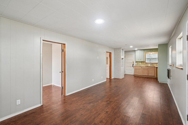 1620 Cavett St, Gonzales, TX 78629 - unfurnished living room featuring dark wood-style flooring and recessed lighting