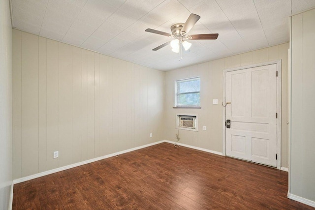 1620 Cavett St, Gonzales, TX 78629 - spare room featuring wood finished floors, ceiling fan, and a wall unit AC