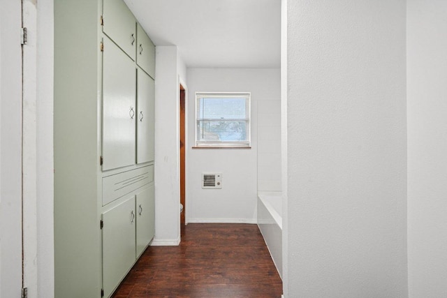 1620 Cavett St, Gonzales, TX 78629 - hall with dark wood-type flooring and baseboards