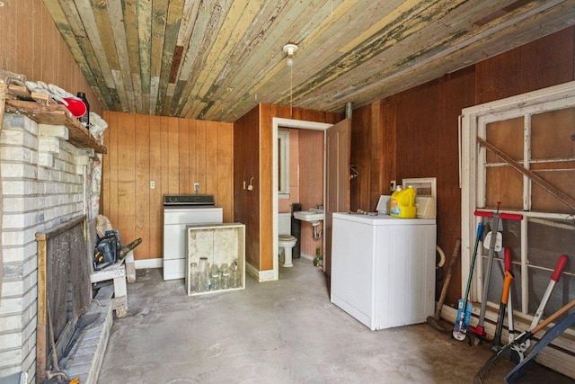 1620 Cavett St, Gonzales, TX 78629 - below grade area featuring washer / dryer, wooden walls, and wooden ceiling