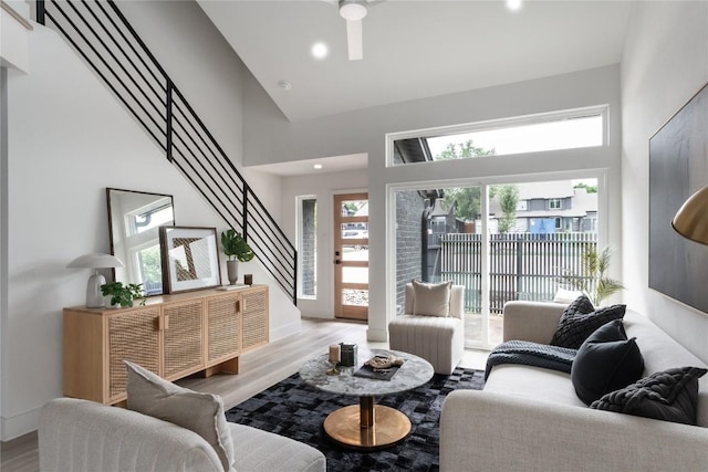 1908 Albury Cv Unit B, Austin, TX 78758 - living area featuring high vaulted ceiling, wood finished floors, recessed lighting, stairway, and a ceiling fan