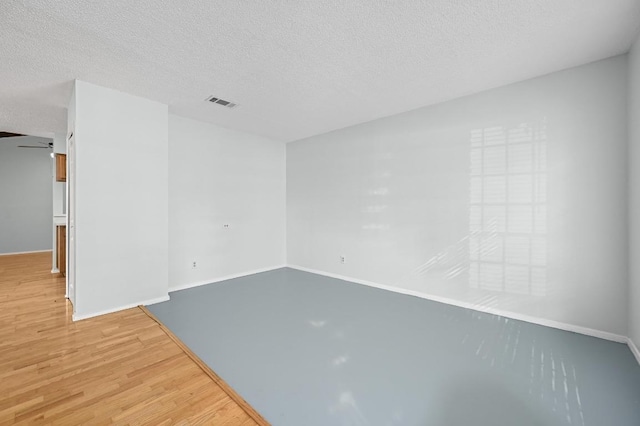 4800 Lansing Dr, Austin, TX 78745 - empty room with light wood-type flooring and a textured ceiling