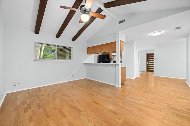 4800 Lansing Dr, Austin, TX 78745 - unfurnished living room featuring light wood-style flooring and a ceiling fan