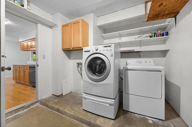 4800 Lansing Dr, Austin, TX 78745 - washroom with washer and dryer and cabinet space
