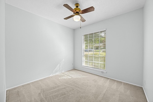 4800 Lansing Dr, Austin, TX 78745 - carpeted empty room featuring a ceiling fan and a textured ceiling
