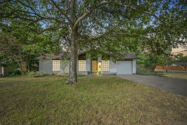 4800 Lansing Dr, Austin, TX 78745 - view of front of house featuring concrete driveway, a front lawn, and a garage