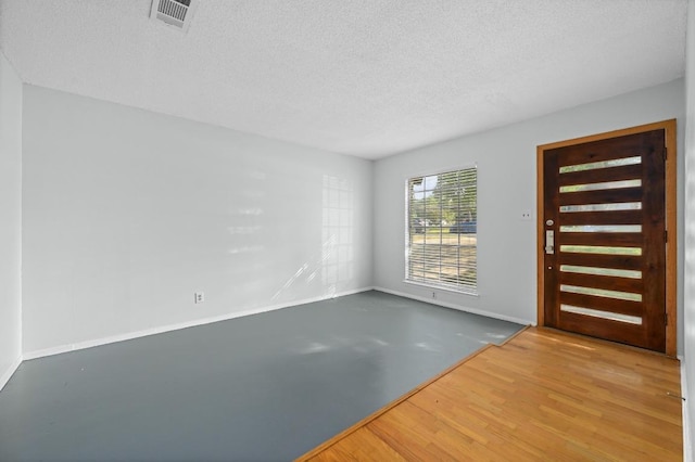 4800 Lansing Dr, Austin, TX 78745 - entryway featuring a textured ceiling and wood finished floors