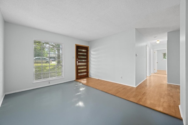 4800 Lansing Dr, Austin, TX 78745 - spare room featuring a textured ceiling and baseboards