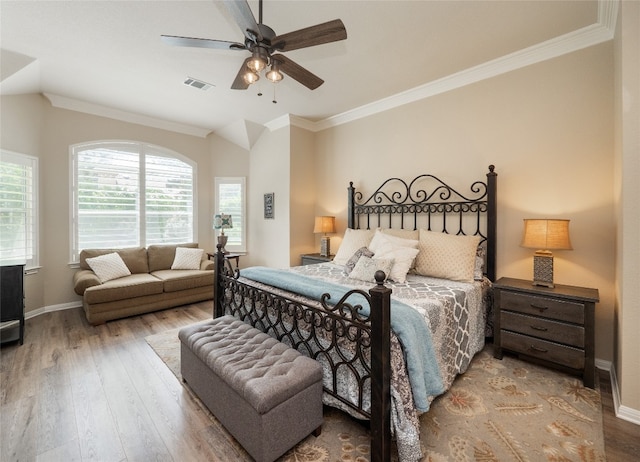 401 Kimra Cv, Georgetown, TX 78628 - bedroom with wood finished floors, ornamental molding, lofted ceiling, and ceiling fan