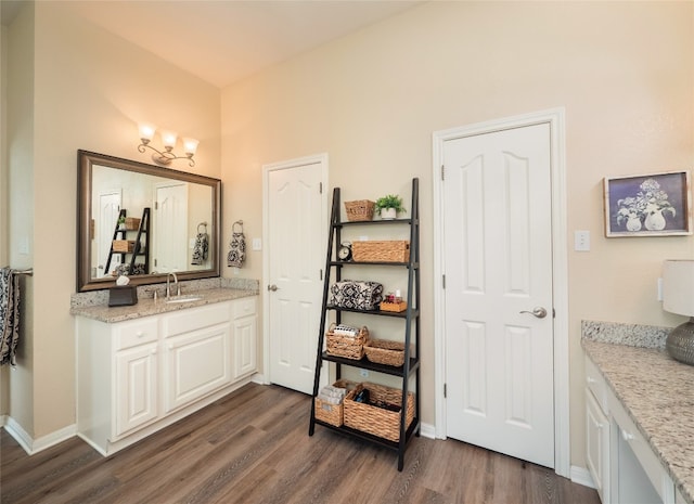 401 Kimra Cv, Georgetown, TX 78628 - bathroom featuring wood finished floors and vanity