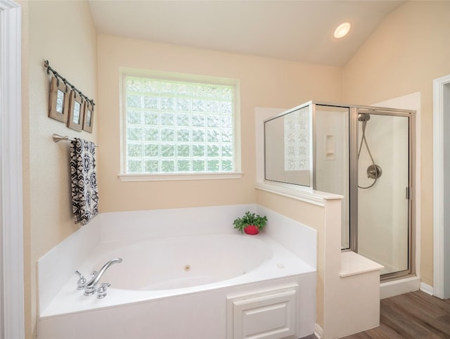 401 Kimra Cv, Georgetown, TX 78628 - full bath with a whirlpool tub, a stall shower, and wood finished floors