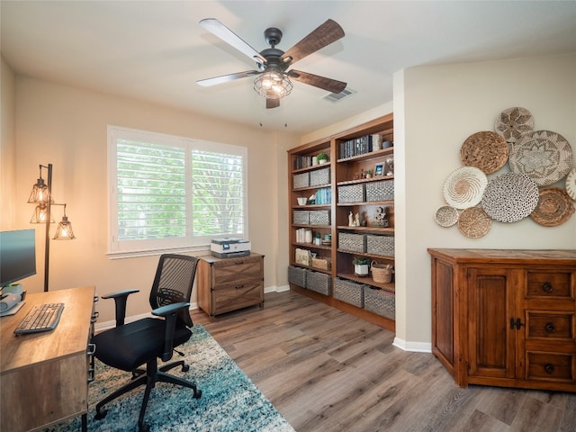 401 Kimra Cv, Georgetown, TX 78628 - office area featuring a ceiling fan and light wood finished floors