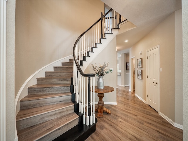 401 Kimra Cv, Georgetown, TX 78628 - staircase featuring wood finished floors and baseboards