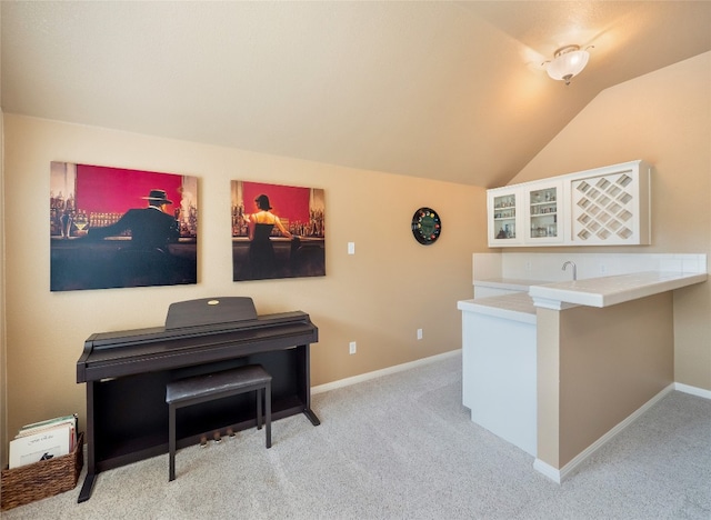 401 Kimra Cv, Georgetown, TX 78628 - office with carpet flooring, vaulted ceiling, and bar with sink