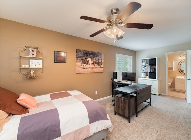 401 Kimra Cv, Georgetown, TX 78628 - bedroom featuring light colored carpet, ensuite bath, and a ceiling fan