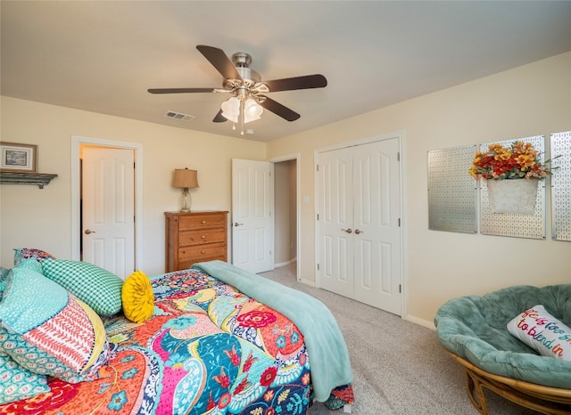 401 Kimra Cv, Georgetown, TX 78628 - bedroom featuring carpet flooring, a closet, and ceiling fan