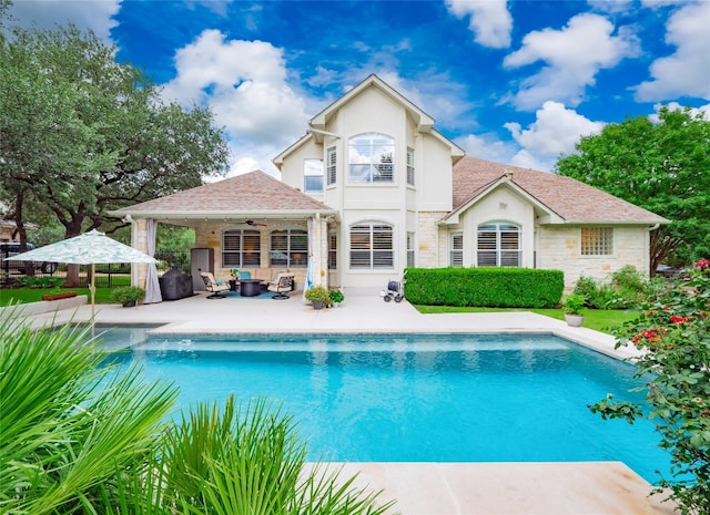 401 Kimra Cv, Georgetown, TX 78628 - outdoor pool featuring a ceiling fan, a patio area, and an outdoor hangout area