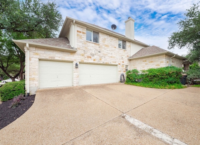 401 Kimra Cv, Georgetown, TX 78628 - view of front facade featuring stone siding, driveway, a chimney, a garage, and a shingled roof