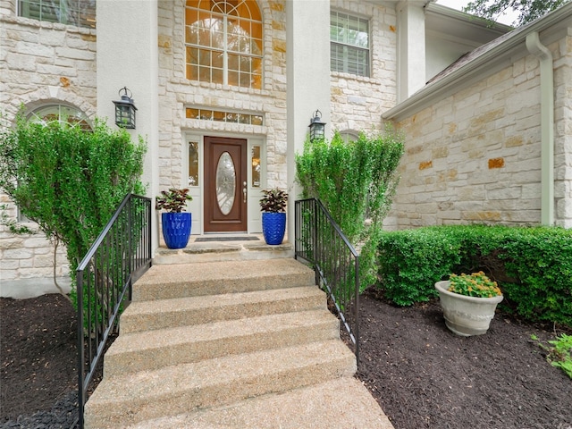 401 Kimra Cv, Georgetown, TX 78628 - doorway to property with stone siding and stucco siding