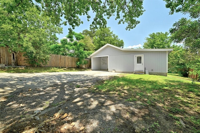 1200 Walnut Ave, Austin, TX 78702 - view of side of home featuring driveway and a carport
