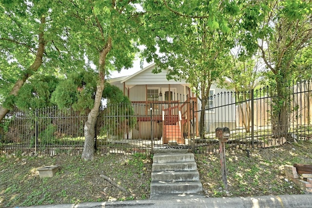 1200 Walnut Ave, Austin, TX 78702 - obstructed view of property with a porch and stairs