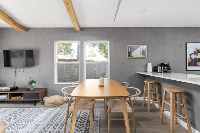 4911 Brighton Rd, Austin, TX 78745 - dining space featuring wood finished floors and beam ceiling