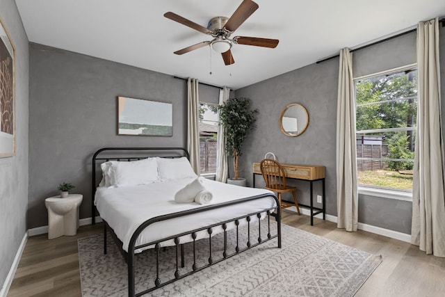 4911 Brighton Rd, Austin, TX 78745 - bedroom featuring wood finished floors and ceiling fan