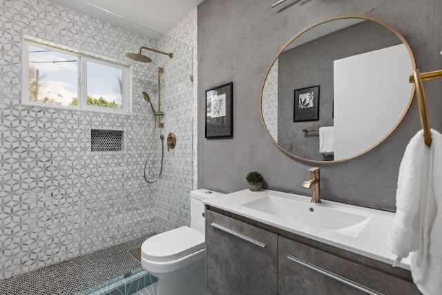 4911 Brighton Rd, Austin, TX 78745 - bathroom featuring tiled shower, vanity, and tile patterned flooring
