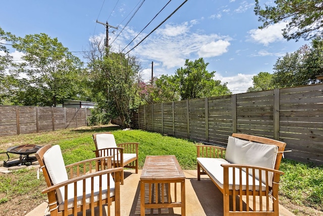 4911 Brighton Rd, Austin, TX 78745 - fenced backyard featuring a patio and an outdoor living space with a fire pit