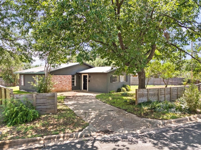 4911 Brighton Rd, Austin, TX 78745 - view of front of house featuring concrete driveway