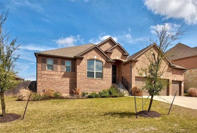 578 Ledge Stone Dr, Austin, TX 78737 - view of front of property featuring driveway, brick siding, and a garage